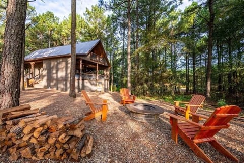 Cozy fire pit surrounded by peaceful Broken Bow forest views