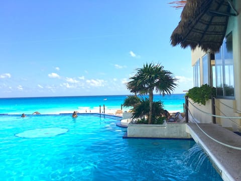 2 outdoor pools, pool umbrellas, sun loungers