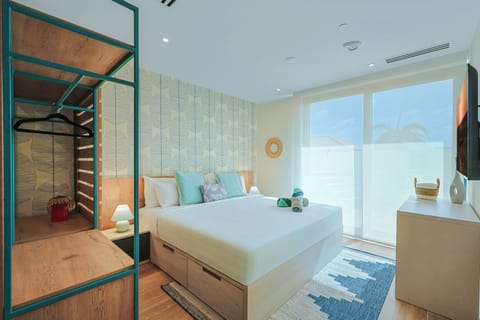 Your bright bedroom invites rest with coastal accents and natural light—crisp linens, soothing teal tones, make this space feel like home.
