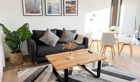 Sunlit living room with dining table