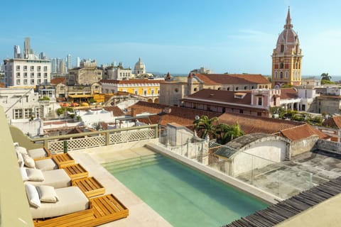 Outdoor pool, open 8:00 AM to 8:00 PM, sun loungers