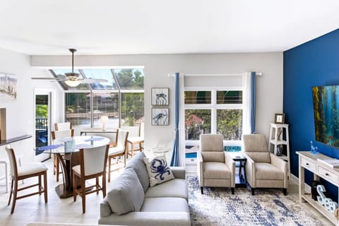 The open living and dining area offers plenty of space to relax and gather together.