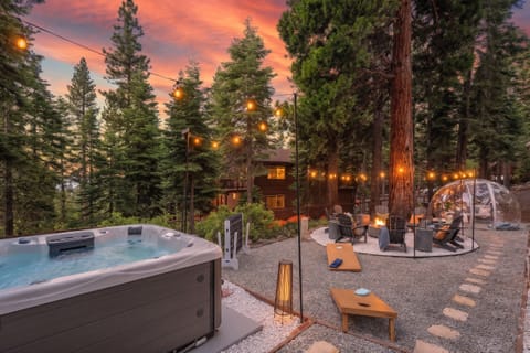 Outdoor area w/ hot tub, games, and multiple seating option