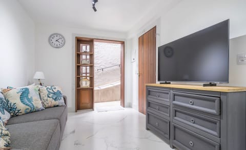Basic Apartment | Living area | 40-inch TV with digital channels