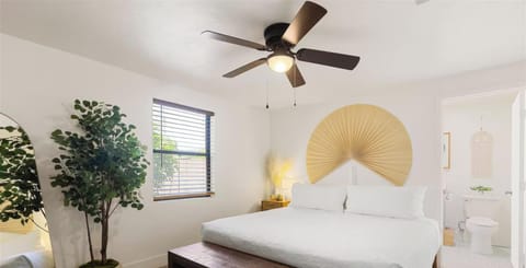 Bright, stylish bedroom with en suite bath and serene modern decor