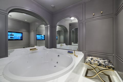 Separate tub and shower, designer toiletries, hair dryer, bathrobes