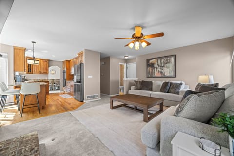 Bright, comfortable living room with plenty of seating for relaxing and spending time together.