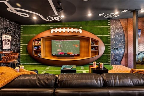 Game Room- One of a king football wall for watching the best games.