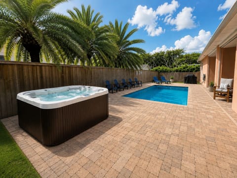 Outdoor oasis with brand new hot tub and heated pool.