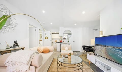 Bright and cozy living room with a comfortable sofa bed
