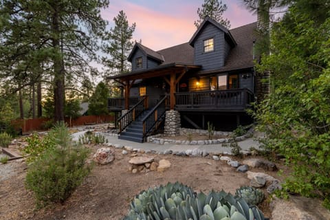 A stunning 4 bedroom, 3 bathroom Idyllwild retreat with a wraparound deck, private hot tub, and more!
