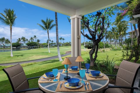 Picture yourself enjoying morning coffee or sunset drinks at your private outdoor table, with sweeping greens and swaying palms just beyond your lanai.