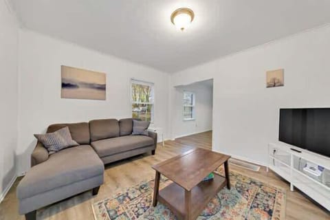A stylish and spacious living room, perfect for relaxing after a day of sightseeing near the Ohio State University campus.