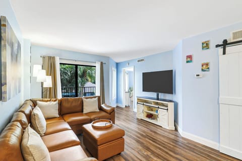Ocean Walk 209A - Comfortable seating with a large screen TV in the living room.
