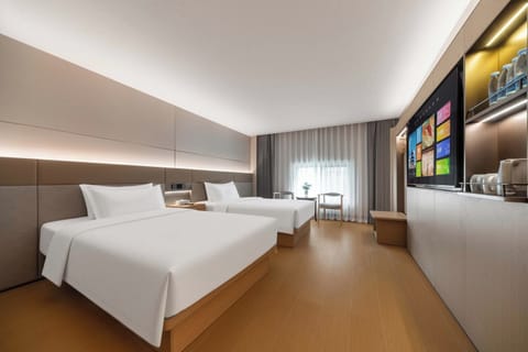 Comfort Twin Room, City View | Minibar, desk, laptop workspace, blackout drapes