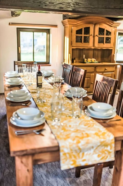 Furniture, Interior Design, Wood, Table, Dining Room, Tableware, Flooring, Kitchen & Dining Room Table, Lighting, Chair