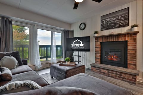 Put your feet up by the brick fireplace, queue up a movie, or slide open the doors for fresh mountain air.