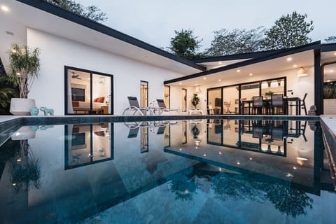 The pool at golden hour. The villa glows, the water becomes a mirror, and the night ahead feels entirely yours. This is what a stay at Villa Selah actually feels like.