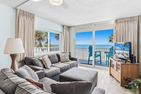 Sink into plush seating and let the stunning ocean panorama draw you in. Your private balcony awaits with coastal breezes and endless beach views.