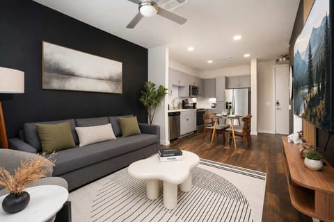 Comfortable open living space with Smart TV and elegant, modern finishes.