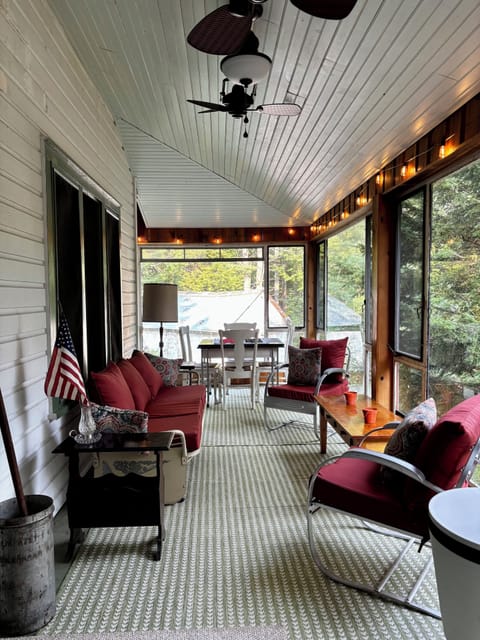 Fully enclosed porch with windows that open & ceiling fan