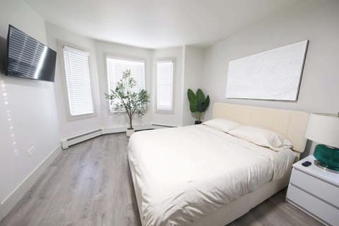 This bedroom has a smart TV with streaming apps. 