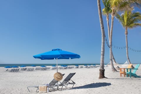 Claim a beach chair on the wide shoreline and watch the horizon meet the open water.