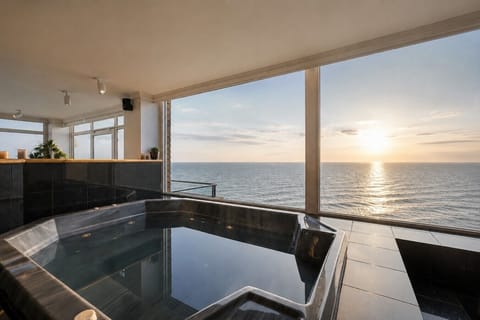 Oversized indoor spa with uninterrupted ocean outlook.