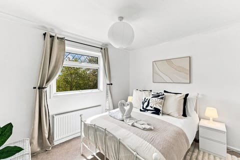 Bedroom 1 features a comfortable double bed with fresh linen and towels provided.