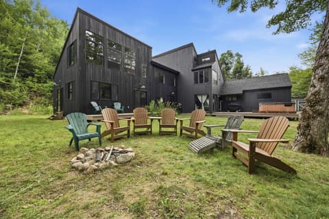 Gather around the firepit in the grassy backyard, with Adirondack chairs set out for evenings under the trees. Please note the hot tub is currently out of service and is expected to be available after Labor Day.