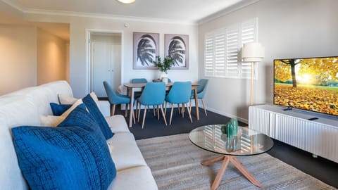 Relax in the stylish lounge with comfortable seating and TV.