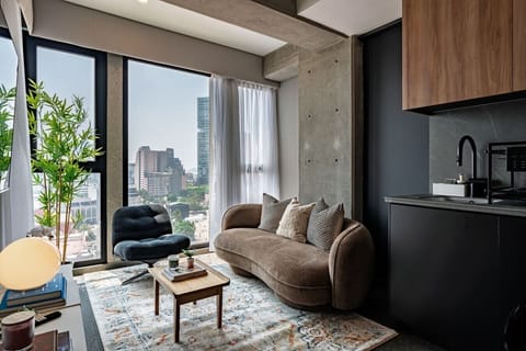 Relax in the stylish living area featuring comfortable seating and modern décor.