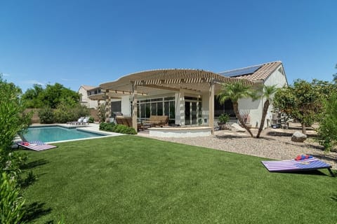 Your private backyard oasis awaits with a sparkling pool, sun loungers, and plenty of space to soak up the Arizona sunshine.