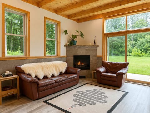 Living Area: Relax in a cozy open-concept living room that flows seamlessly into the kitchen, creating a welcoming space for lounging, dining, and spending quality time together.