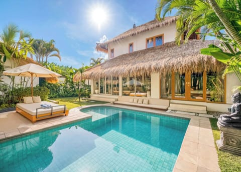 A tropical retreat where sunlight dances across the pool