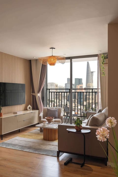 Cozy living area with breathtaking city views and a clear sight of the iconic Bitexco Tower