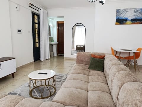Deluxe Apartment | Living area | 32-inch Smart TV with digital channels