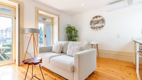 Bright, contemporary living area filled with natural light and designed for relaxing after a day exploring Porto. #ModernStay #PortoLiving #LovelyInteriors