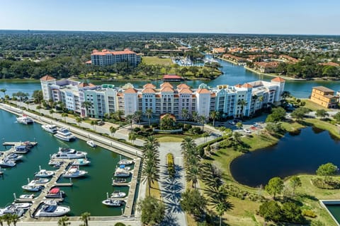 Marina with boats moored beneath the resort's red-roofed tower