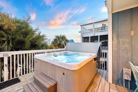 Soak in your private hot tub as the sun sets, surrounded by swaying palms and a coastal breeze that invites pure relaxation.