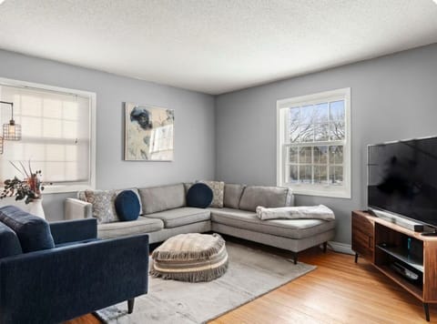 Bright, cozy living room with sectional seating and plenty of natural light