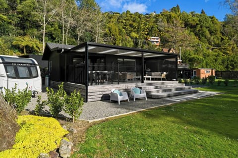 Relax on the deck which opens out onto. huge flat green lawn area.