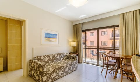 Basic Apartment | Living area | 40-inch TV with digital channels
