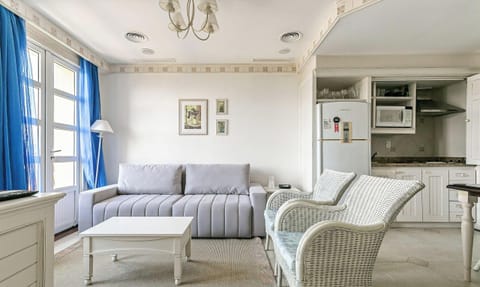 Basic Apartment | Living area | 40-inch TV with digital channels