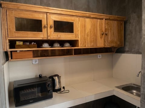Superior Villa, Balcony, Ocean View | Private kitchen | Mini-fridge, microwave, dishwasher, dining table