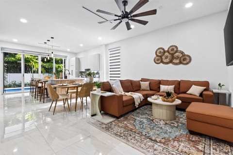 Bright open-plan living with plush seating and an easy indoor-outdoor flow.