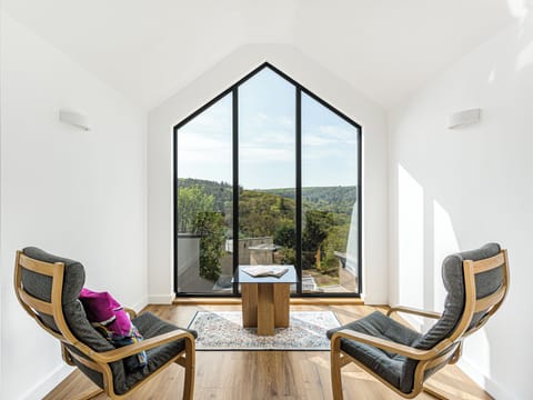 Relax in style with panoramic views across the Devon valley.