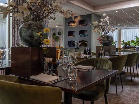 Savor an intimate dinner surrounded by soft lighting and florals
