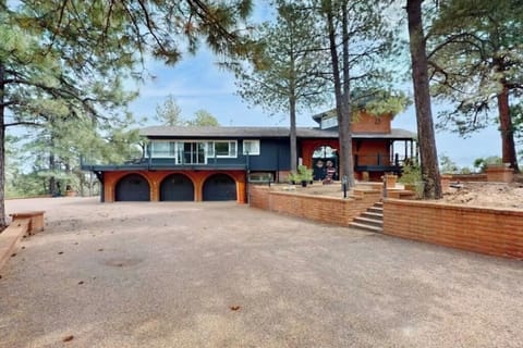 Welcome to your mountain lodge in the pines — 5 bedrooms, 5.5 baths, and room for 16