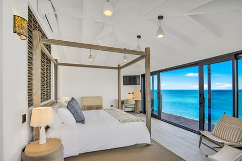 Wake to dazzling blue water right outside your bed.